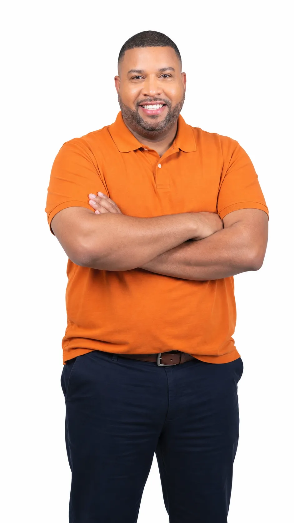 Smiling man with crossed arms wearing an orange polo shirt and dark pants, founder of Lightning Leads Pro